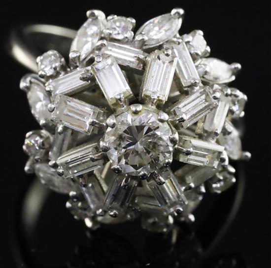 A diamond cluster ring set with brilliants, navette and baguette stones, 18ct white gold and platinum setting, size T.